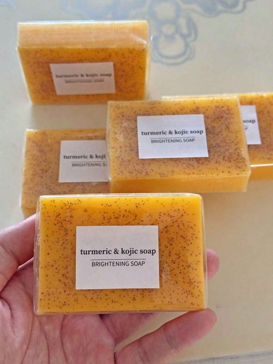VitaBuy turmeric lemon kojic acid handmade soap with foaming net, showcasing the soap’s textured surface and packaging.